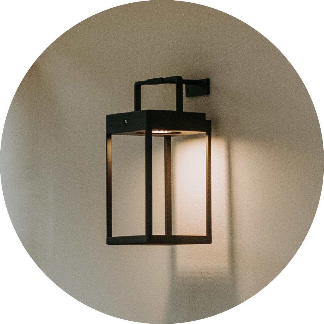 Black outdoor wall light fixture on a neutral wall